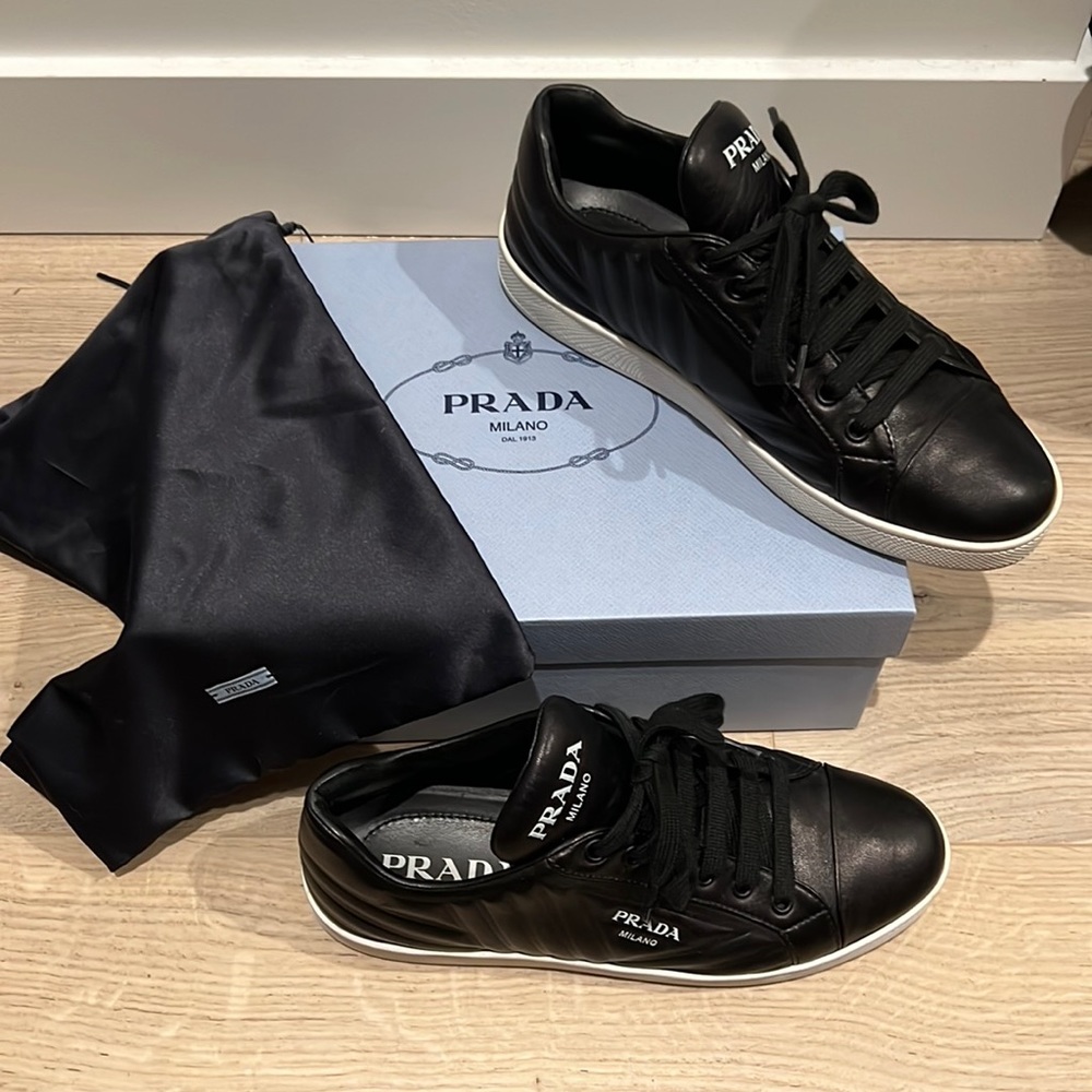 These are the quilted black leather PRADA sneakers.Size EU 8.5.PERFECT CONDITION